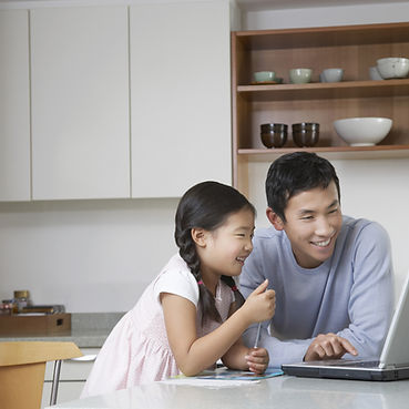 Father and daughter at computer